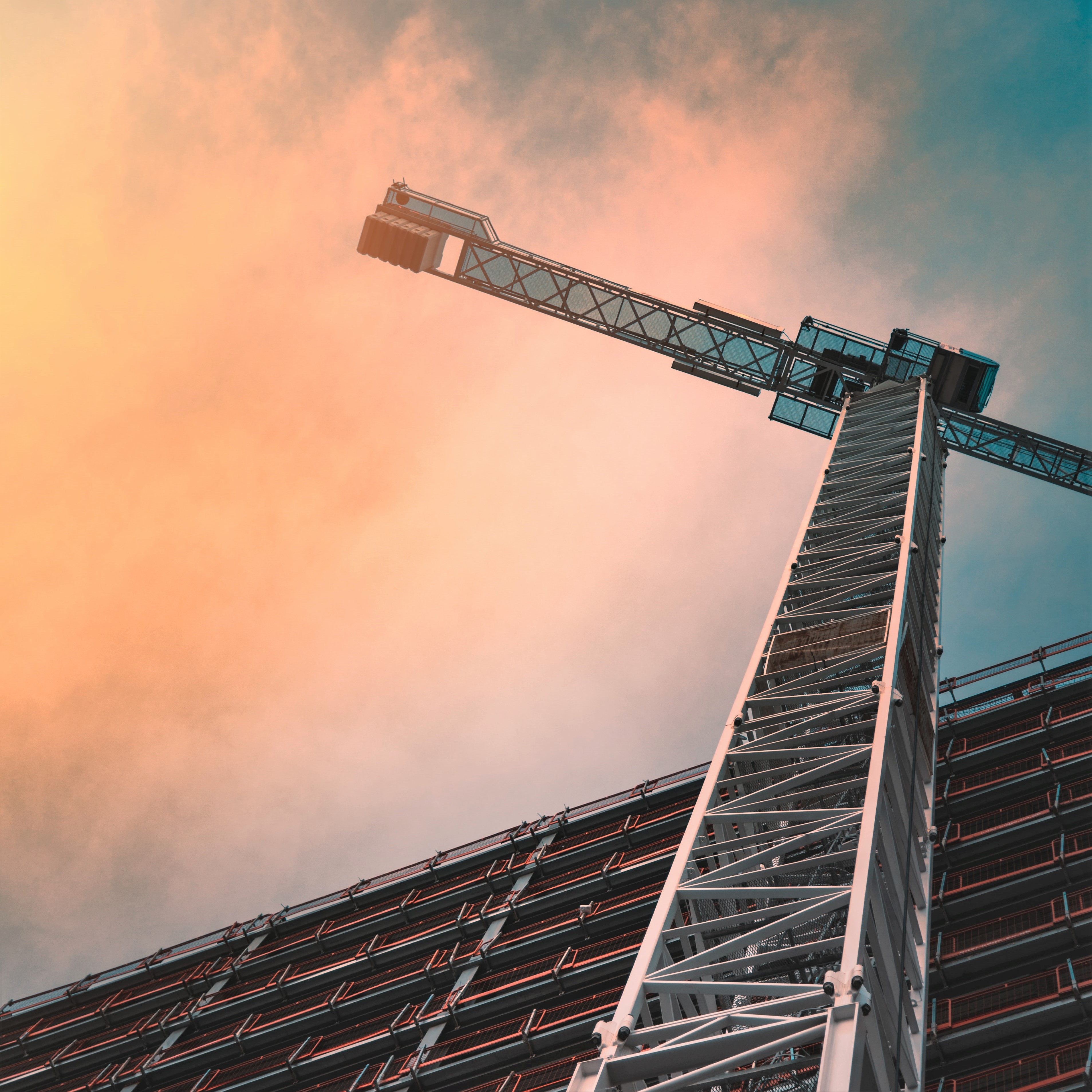 Construction crane against evening sky